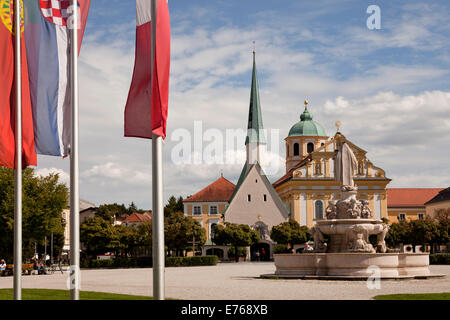 fountain  of Maria, church Magdalenakirche and the Chapel of Grace on Kapellplatz square in Altoetting, Upper-Bavaria, Bavaria, Stock Photo