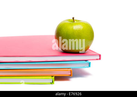 Green apple on notebooks Stock Photo