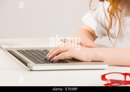 Female hands typing on laptop Stock Photo