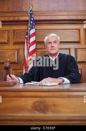 Judge banging gavel in court Stock Photo