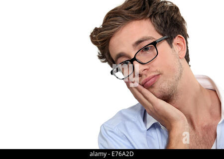 A bored young man. Stock Photo