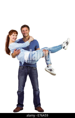 Man lifting up his girlfriend Stock Photo