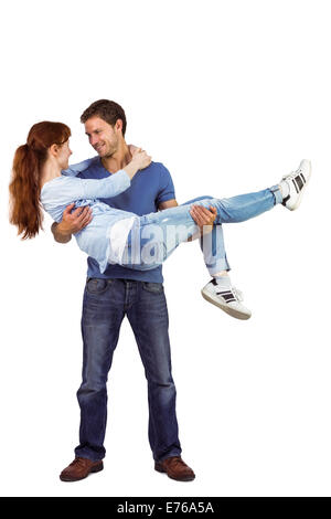 Man lifting up his girlfriend Stock Photo