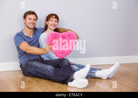 Couple holding a large heart Stock Photo