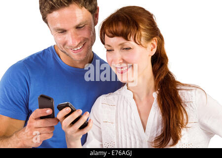 Couple using their mobile phones Stock Photo