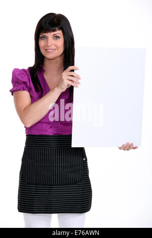 Woman holding up a blank board Stock Photo