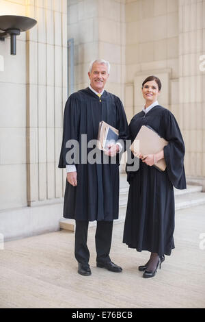 Judges standing together in courthouse Stock Photo
