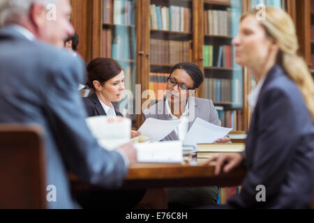 Lawyers examining documents in chambers Stock Photo