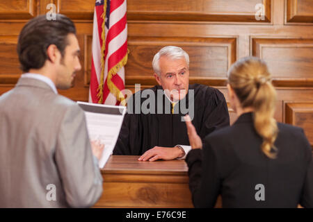 Lawyers pleading case to judge in court Stock Photo