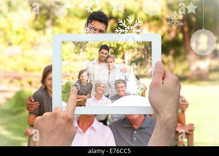 Composite image of hands holding tablet pc Stock Photo