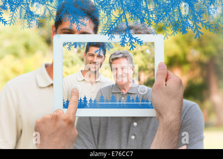 Composite image of hands holding tablet pc Stock Photo