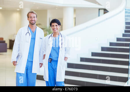 Doctors smiling in hospital Stock Photo