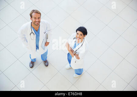 Doctors smiling in hospital Stock Photo