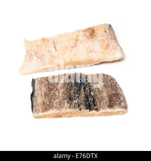 Pieces of salt cod fish isolated on a white studio background. Stock Photo