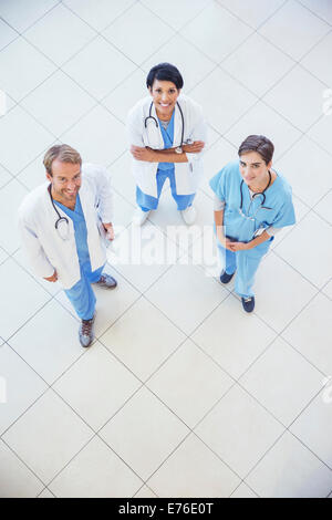 Doctors and nurse smiling in hospital Stock Photo