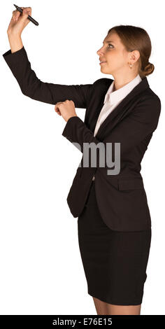 Beautiful girl in business suit holding pen and writing Stock Photo