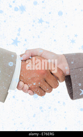 Composite image of side view of shaking hands closing a deal Stock Photo