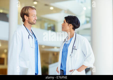 Doctors talking in hospital Stock Photo