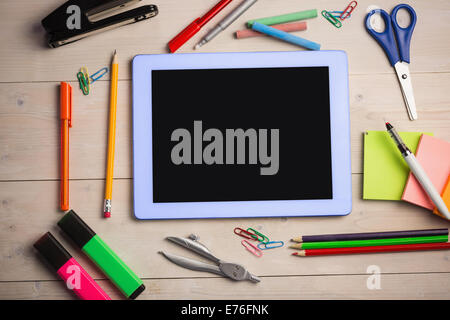 Students table with school supplies Stock Photo