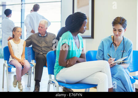 Nurse and patient talking in hospital Stock Photo