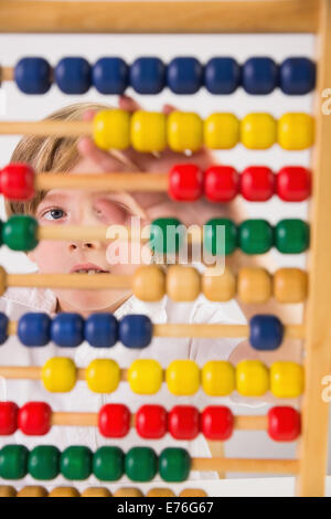 Student doing maths on abacus Stock Photo