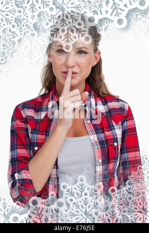 Smiling woman asking for silence Stock Photo - Alamy