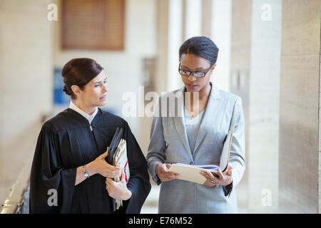 Judge and lawyer talking in courthouse Stock Photo