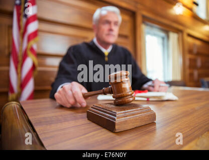 Judge holding gavel in court