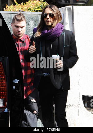 Actor Jared Leto emerges after winning an oscar last night for best supporting actor on his role in 'Dallas'Buyers Club'. The oscar winner spotted wearing a all dark clothing as he steps in a limo and heads to the Ellen DeGeneres show to celebrate his win Stock Photo