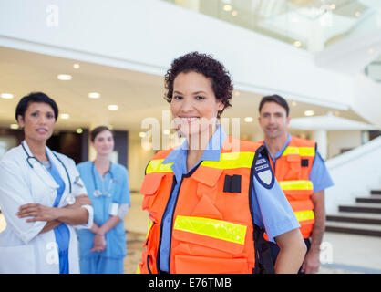 Doctor, nurse and paramedics standing in hospital Stock Photo