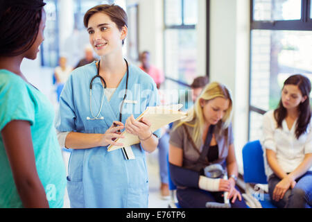 Nurse and patient talking in hospital Stock Photo