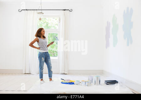 Woman observing paint swatches Stock Photo