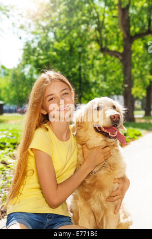Teen girl with golden retriever dog Stock Photo - Alamy
