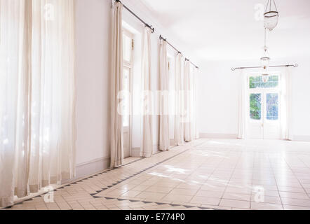 Sunlight streaming through windows of living space Stock Photo
