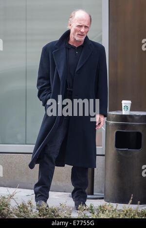 An unshaven Ed Harris lights up a cigarette while taking a coffee break, resting his cup on a trash bin outside his hotel  Featuring: Ed Harris Where: New York City, New York, United States When: 05 Mar 2014 Stock Photo