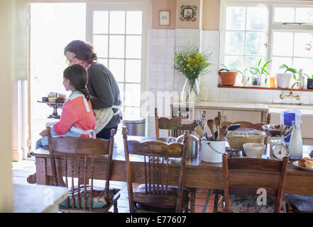 Grandmother offering granddaughter cupcakes Stock Photo