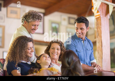 Family gathered on the couch together Stock Photo
