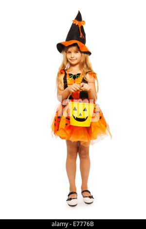 Little witch with Halloween bucket Stock Photo
