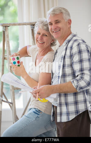 Older couple looking through documents together Stock Photo