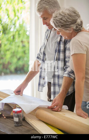Older couple looking through documents together Stock Photo