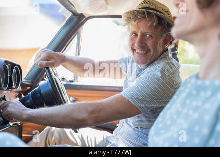 Older man starting car ignition Stock Photo