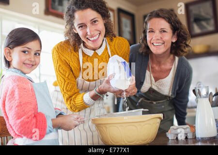 Three generations of women baking together Stock Photo
