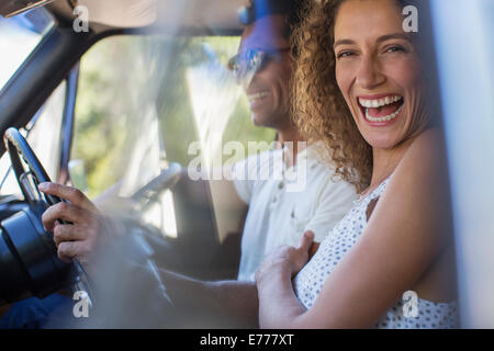 Couple riding in car together Stock Photo