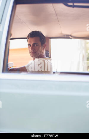 Man driving car on sunny day Stock Photo