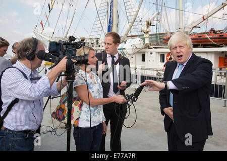 London, UK. 8th Sep, 2014. London Mayor Boris Johnson talks to the press during a visit to Royal Greenwich Tall Ships Festival which is organized by RB Greenwich. The Festival is included as a highlight of Totally Thames, the new month-long promotion of river and riverside events delivered by Thames Festival Trust. Credit:  Michael Kemp/Alamy Live News Stock Photo
