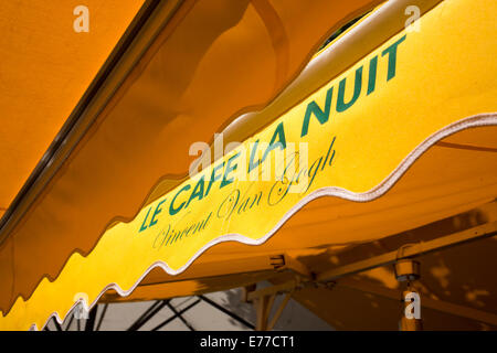 Yellow awnings of Le Cafe la Nuit in Arles Provence France Stock Photo