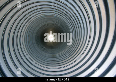 Pattern inside huge metal conduits. Stock Photo
