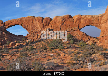 North and South Window Arch at sunrise in Arches National Park near Moab, Utah Stock Photo