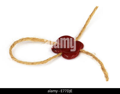 Wax seal on rope knot over white background Stock Photo