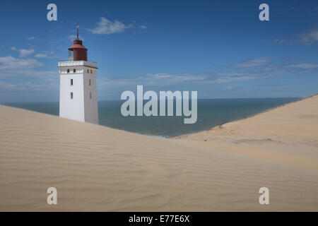 Rubjerg Knude Lighthouse  on the coast of the North Sea in Jutland Denmark. The lighthouse is now decommissioned. Stock Photo